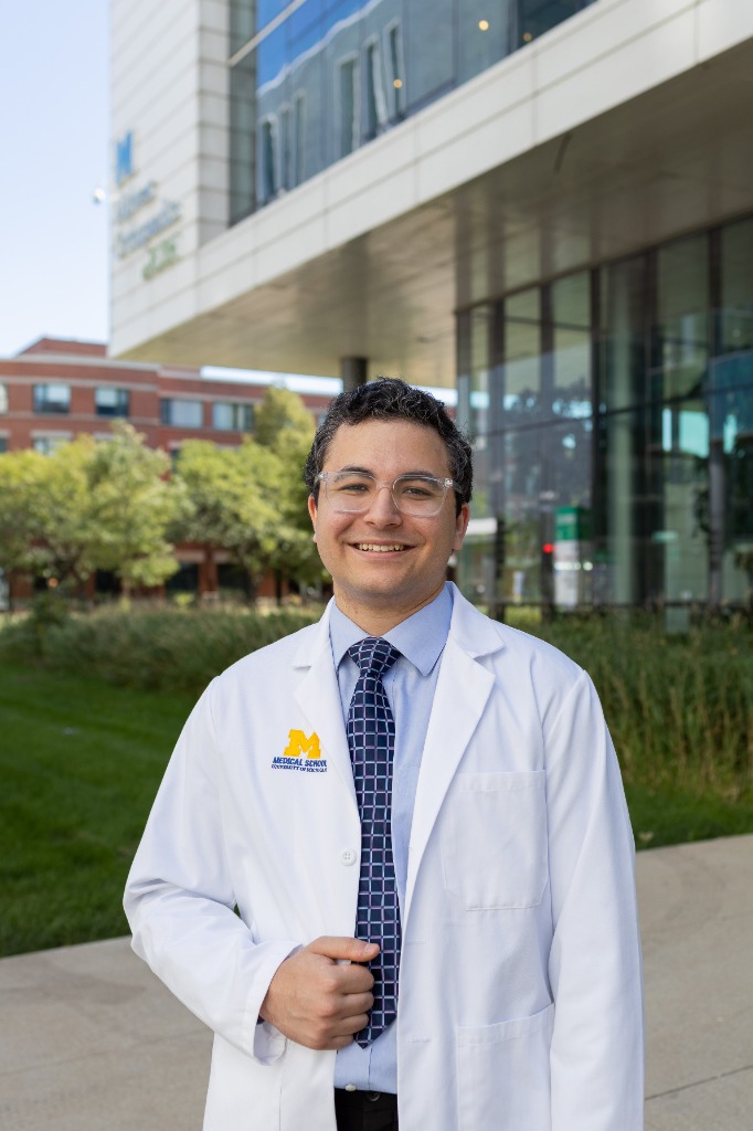 Professional medical school headshot in white lab coat